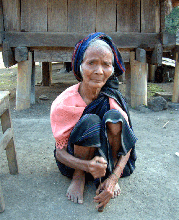 Pounding lime to go with her betel nut chew