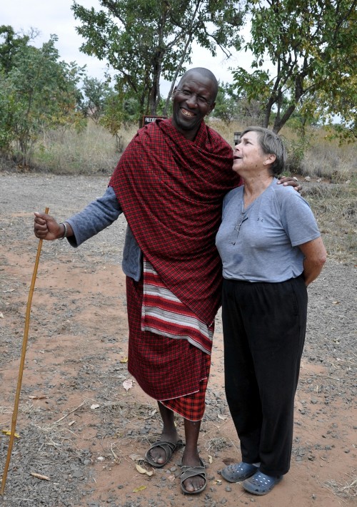 Dee charming and being charmed by a local Maasai